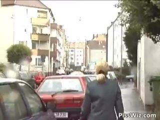 Mature whore pisses all over the place