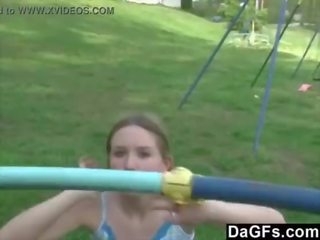 Young rumaja plays in the park and flashes her body