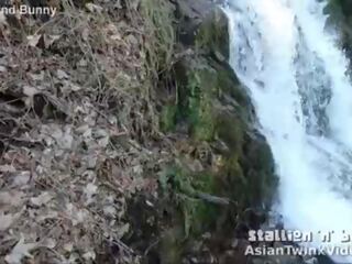 Asia twink sucks manhood by waterfall